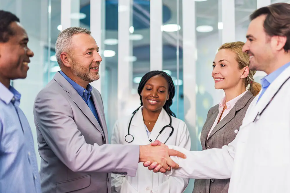 Happy business people and doctors came to an agreement.